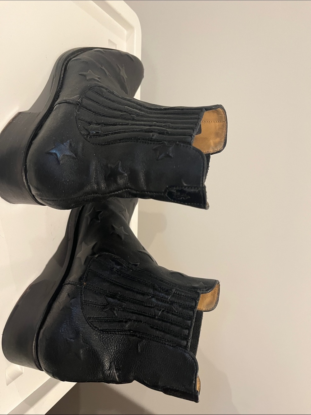 Black Star-Embossed Chelsea Ankle Booties